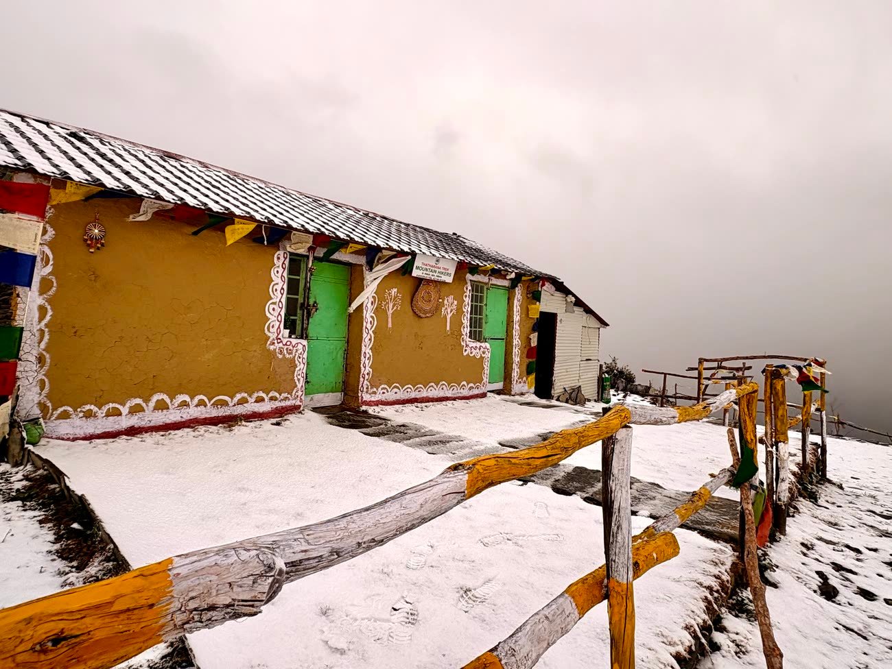 The mudhouse and campsite under fresh snowfall in winter