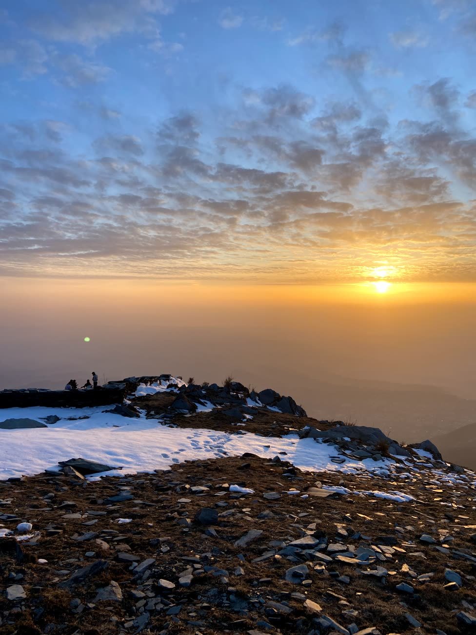 Sunrise above the clouds seen from the ridge at Thatharana